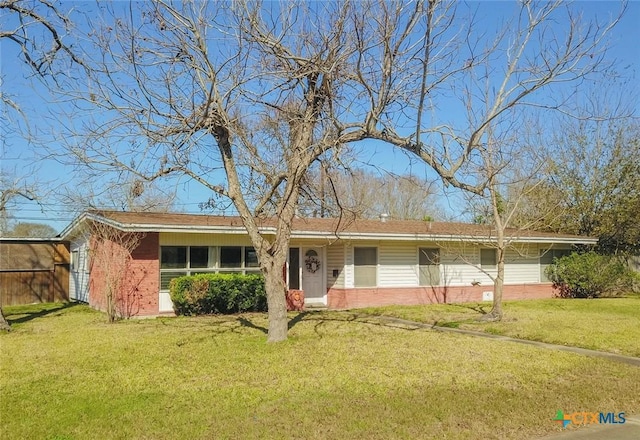 ranch-style home featuring a front yard