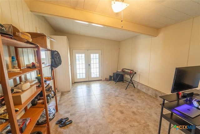 interior space featuring beamed ceiling and french doors