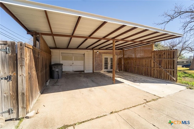 exterior space with a carport and french doors