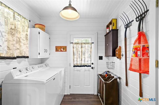 406 E Goodwin Ave, Victoria, TX 77901 - laundry room featuring cabinet space, washing machine and dryer, and dark wood finished floors