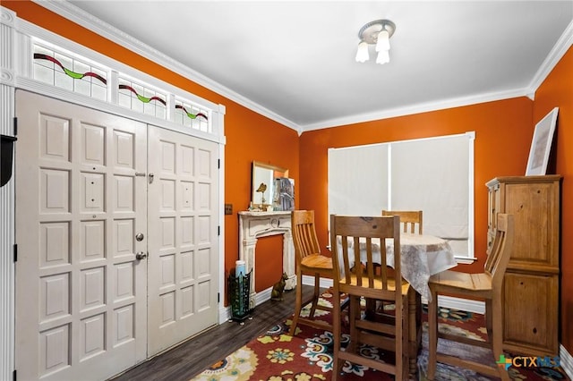 406 E Goodwin Ave, Victoria, TX 77901 - dining space with ornamental molding and dark wood-style floors