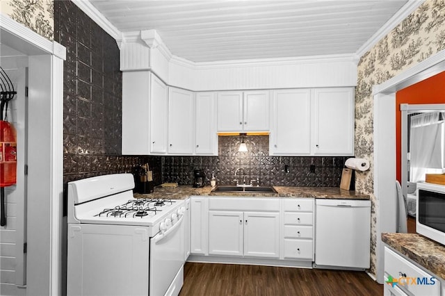 406 E Goodwin Ave, Victoria, TX 77901 - kitchen featuring white appliances, white cabinets, crown molding, dark wood-style flooring, and backsplash