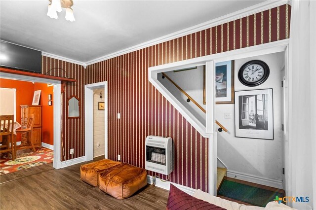 406 E Goodwin Ave, Victoria, TX 77901 - living room with heating unit, wood finished floors, stairs, and ornamental molding