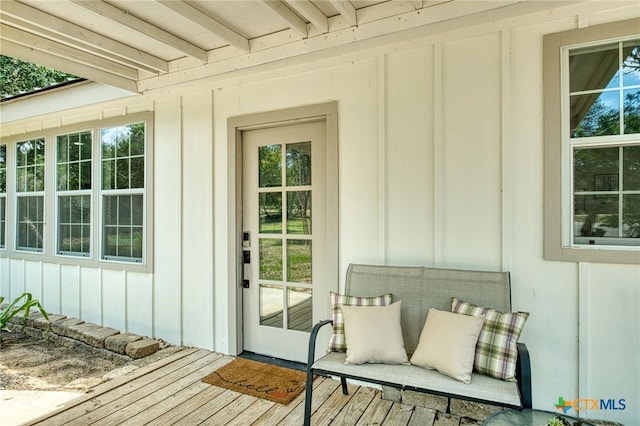 1606 Lone Man Mountain Rd, Wimberley, TX 78676 - doorway to property with board and batten siding and a deck