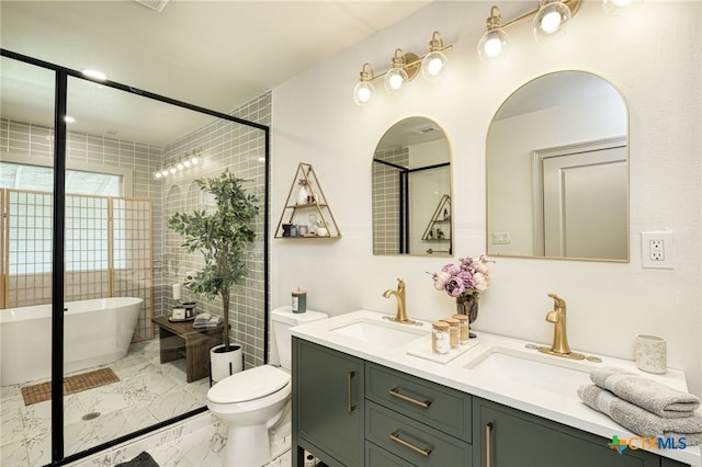 1606 Lone Man Mountain Rd, Wimberley, TX 78676 - full bathroom featuring marble finish floors, double vanity, a soaking tub, and toilet