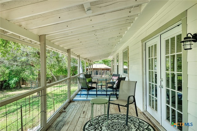 1606 Lone Man Mountain Rd, Wimberley, TX 78676 - wooden terrace featuring french doors and a fenced backyard