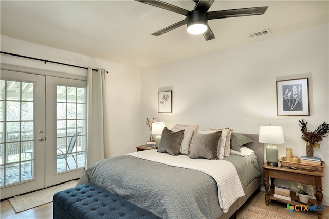 1606 Lone Man Mountain Rd, Wimberley, TX 78676 - bedroom with access to exterior, french doors, a ceiling fan, and wood finished floors