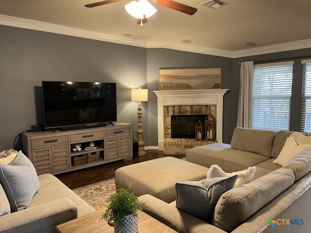 living room with a fireplace, wood-type flooring, ceiling fan, and ornamental molding