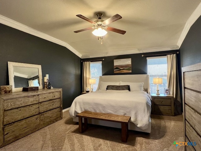 carpeted bedroom with vaulted ceiling, multiple windows, ornamental molding, and ceiling fan