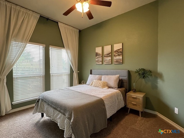 bedroom featuring carpet flooring, vaulted ceiling, and ceiling fan