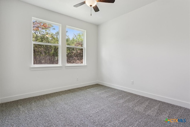 unfurnished room with ceiling fan and carpet floors