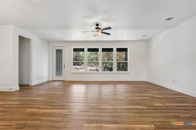 unfurnished living room featuring ceiling fan and wood-type flooring