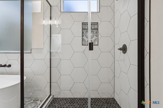 bathroom featuring tile walls and plus walk in shower