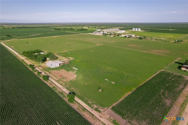 birds eye view of property with a rural view