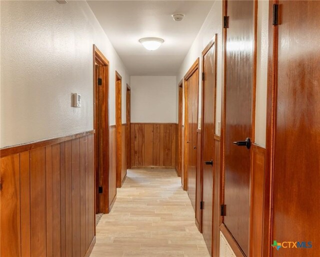 carpeted spare room with ceiling fan and baseboards