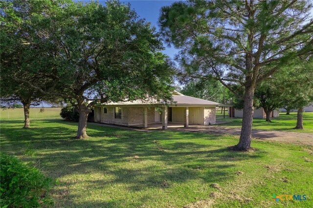 birds eye view of property with a rural view