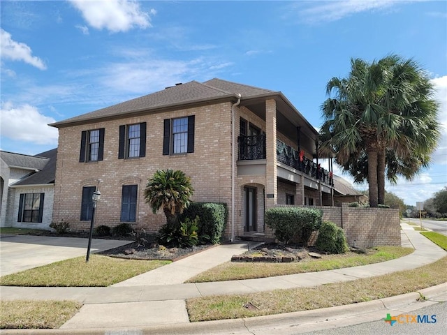 view of front of home featuring brick siding