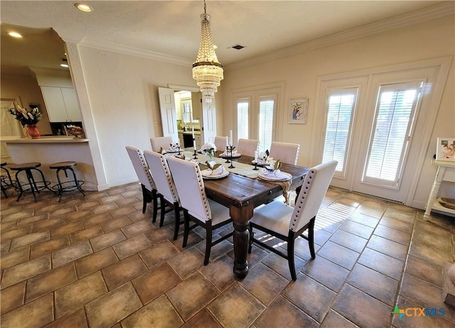 dining room featuring visible vents and crown molding