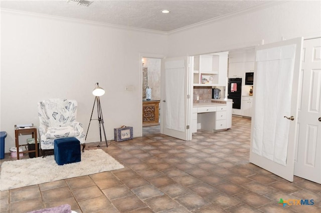 interior space featuring ornamental molding and visible vents