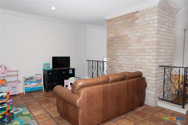 living room with ornamental molding and tile patterned floors