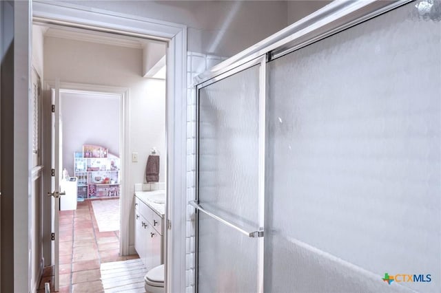 full bath with an enclosed shower, vanity, and tile patterned floors