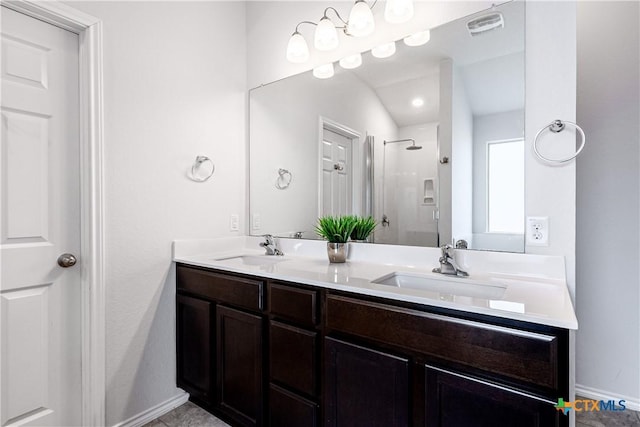 bathroom featuring vanity and a shower with shower door