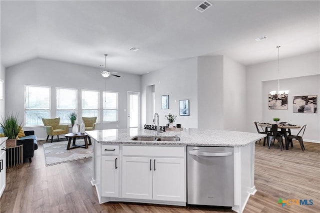 513 Foxbrook Way, Cibolo, TX 78108 - kitchen with stainless steel dishwasher, a sink, a chandelier, wood finished floors, and lofted ceiling