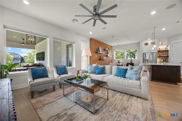 105 Monterey Oak Trl, Georgetown, TX 78628 - living area featuring light wood-type flooring, ceiling fan, and recessed lighting