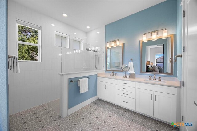 105 Monterey Oak Trl, Georgetown, TX 78628 - full bathroom featuring a walk in shower, connected bathroom, and double vanity