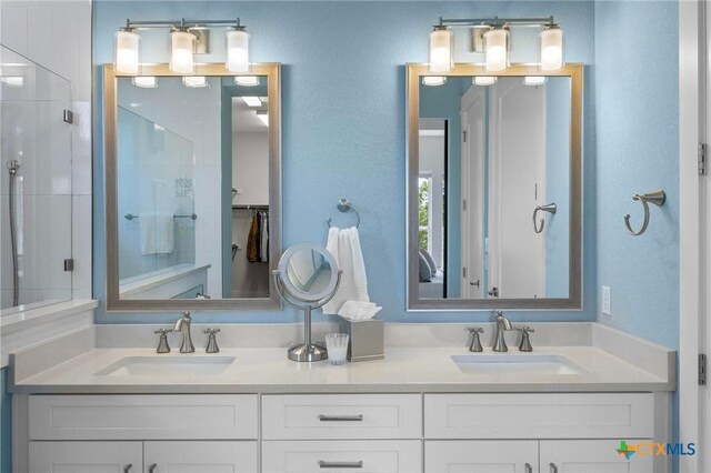 105 Monterey Oak Trl, Georgetown, TX 78628 - bathroom with a stall shower and double vanity
