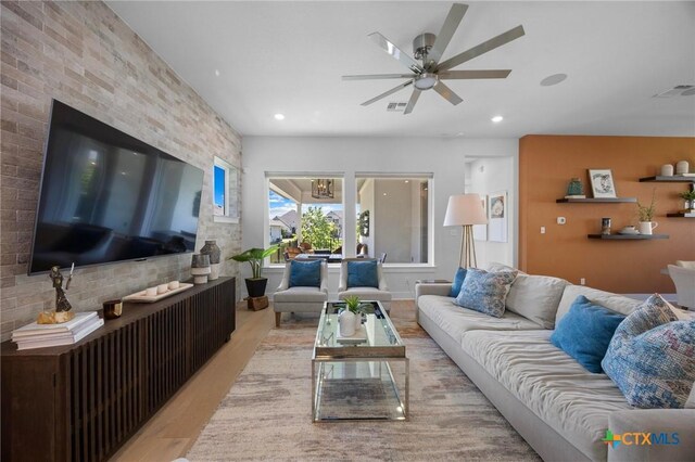 105 Monterey Oak Trl, Georgetown, TX 78628 - living room featuring a ceiling fan, recessed lighting, and wood finished floors