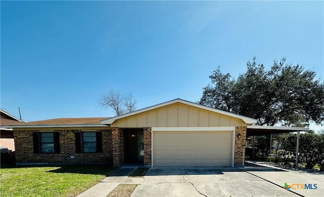 single story home with a carport, brick siding, driveway, and an attached garage