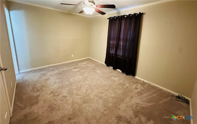 225 Monterrey Dr, Victoria, TX 77904 - spare room with ceiling fan, baseboards, light colored carpet, and crown molding