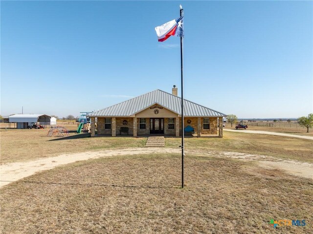 exterior space featuring a rural view and a playground