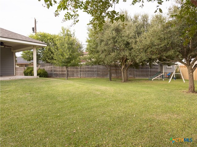 view of yard with a playground and a patio