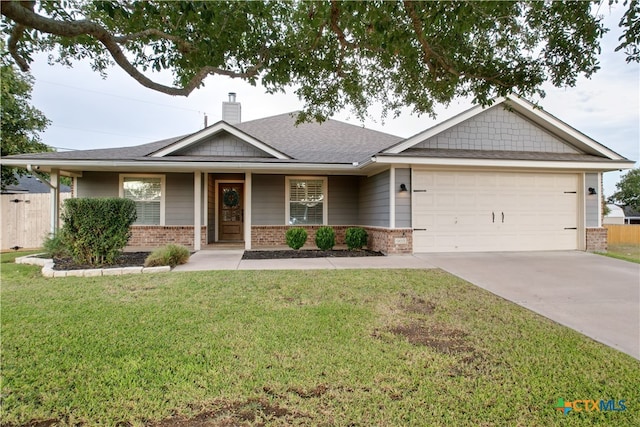 view of front of home with a garage, a porch, and a front lawn