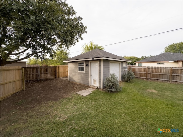 view of outdoor structure with a lawn