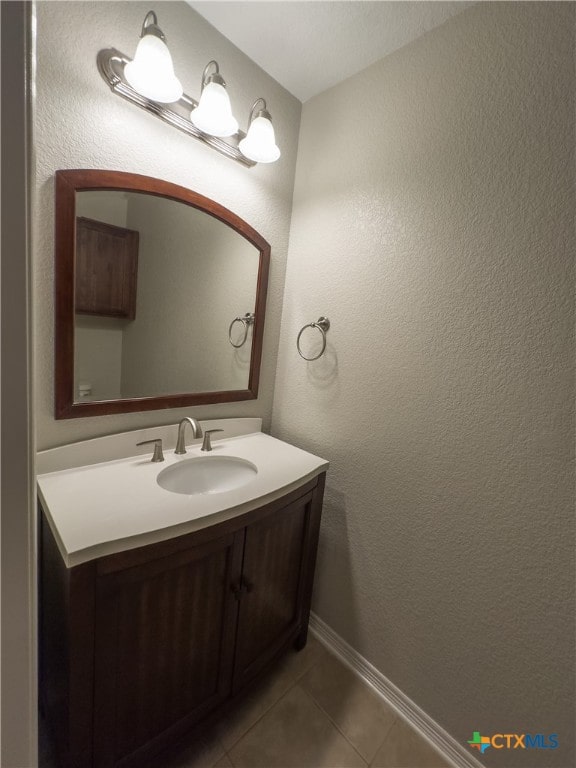 bathroom with vanity and tile patterned flooring