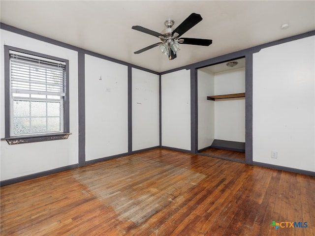 unfurnished bedroom with wood-type flooring and ceiling fan