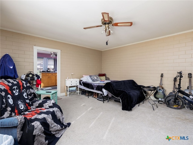 carpeted bedroom with ceiling fan and crown molding