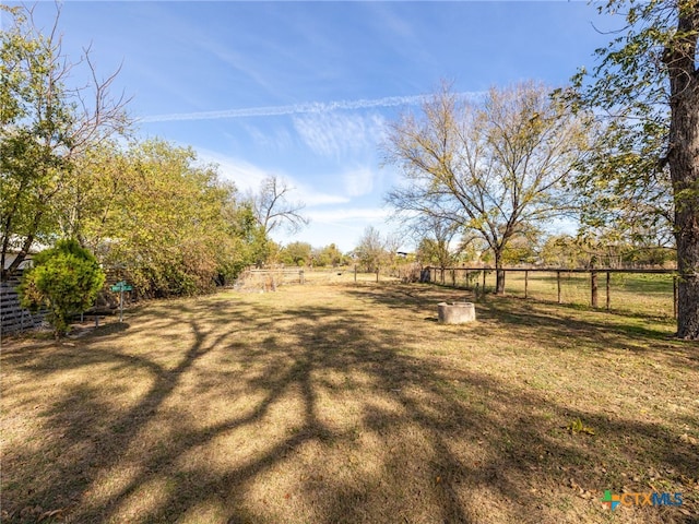 view of yard with a rural view