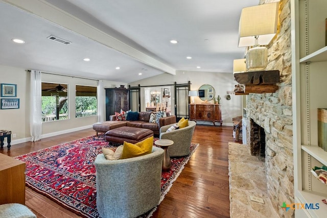 200 W Meadow Ln, Wimberley, TX 78676 - living room with wood finished floors, a stone fireplace, baseboards, recessed lighting, and a ceiling fan