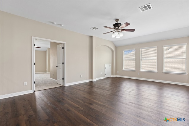 3312 Cortes Pl, Round Rock, TX 78665 - spare room featuring a ceiling fan, dark wood finished floors, baseboards, and arched walkways