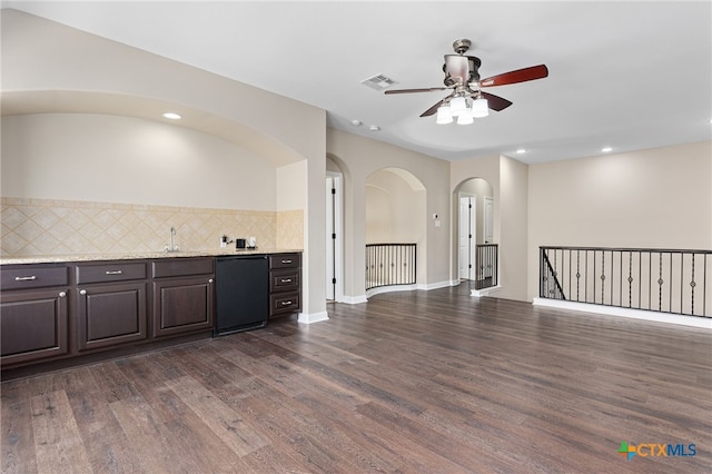 3312 Cortes Pl, Round Rock, TX 78665 - kitchen featuring a ceiling fan, dark wood-style floors, dark brown cabinets, backsplash, and refrigerator