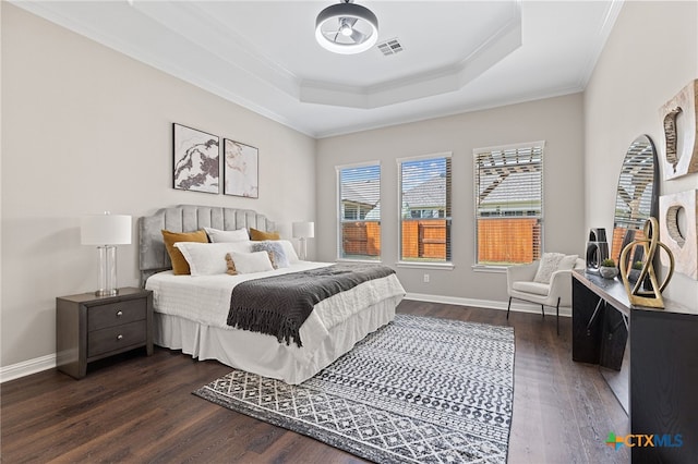 3312 Cortes Pl, Round Rock, TX 78665 - bedroom with ornamental molding, multiple windows, dark wood-style floors, and a raised ceiling