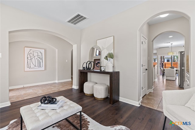 3312 Cortes Pl, Round Rock, TX 78665 - living room featuring wood finished floors, baseboards, and arched walkways