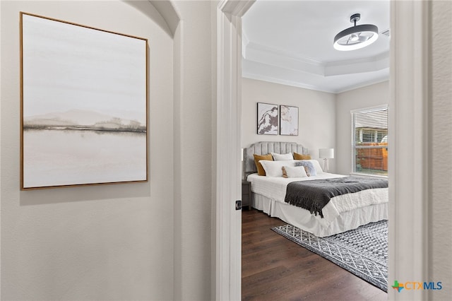 3312 Cortes Pl, Round Rock, TX 78665 - bedroom with ornamental molding, dark wood-style flooring, and a raised ceiling