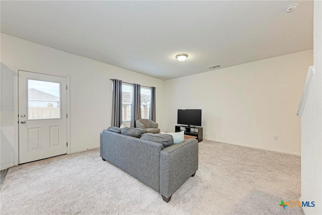 living room featuring light colored carpet