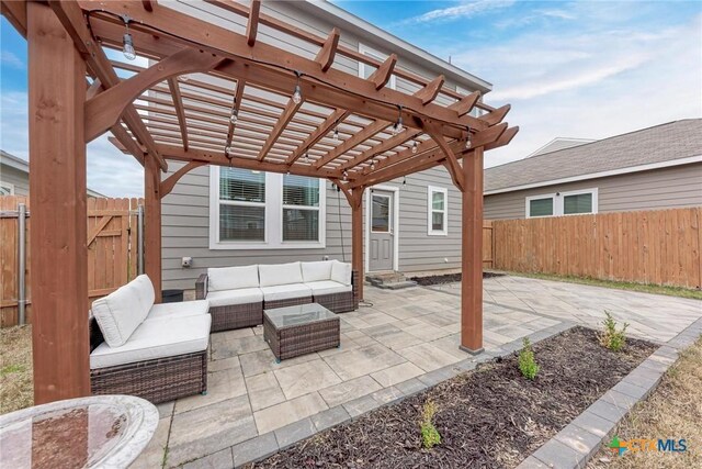 rear view of house with a lawn, a pergola, a patio area, and outdoor lounge area