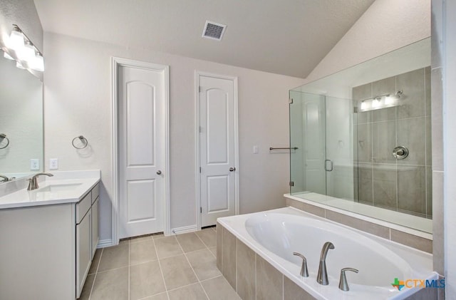 2055 Stephanie Ave, New Braunfels, TX 78132 - bathroom with a bath, vanity, vaulted ceiling, tile patterned floors, and a stall shower